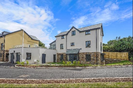 A substantial new build family home with integral garage and large garden terrace located 