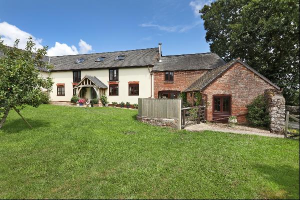 A beautifully presented farm property with outbuildings and extensive grounds.