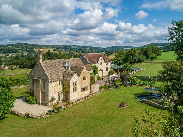 A fabulous Grade II listed Cotswold stone farmhouse with additional accommodation and a st