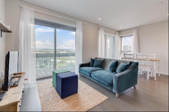 A two bedroom, lateral apartment in a modern development, with a private balcony. 