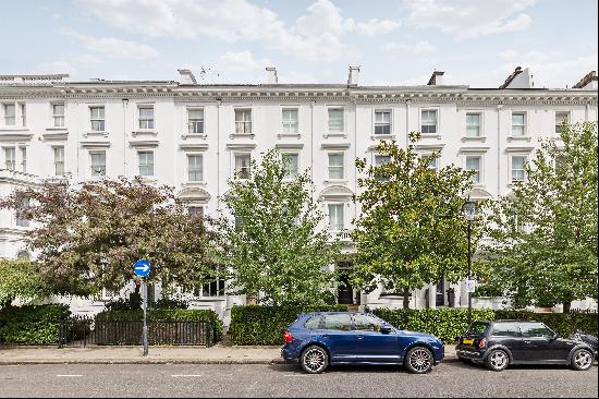 A beautifully refurbished six-bedroom family house for sale in Kensington, W8.