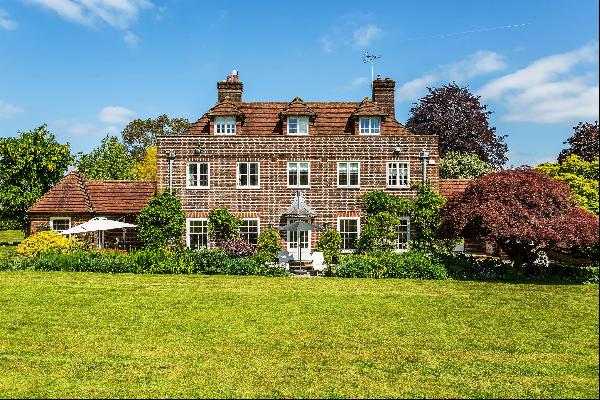 A stunning country home in a prime setting, hidden away amongst beautiful gardens and grou