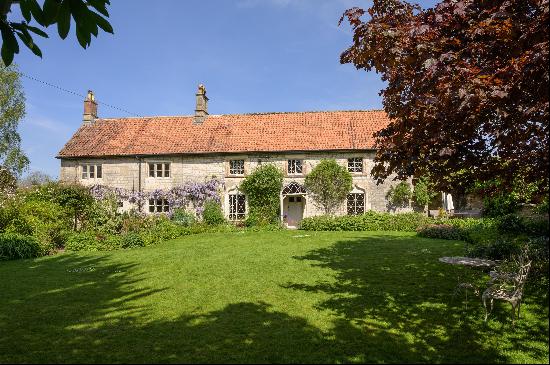 A gorgeous Grade II listed 5 bedroom detached family house, set in pretty gardens.