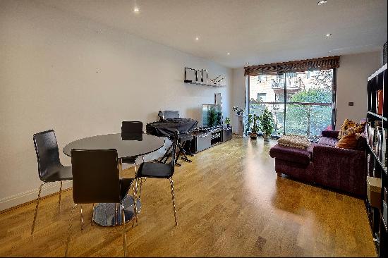 A stunning contemporary 2 bed apartment for sale with balcony and underground parking in a