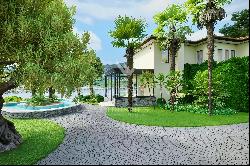 Beautiful villa for sale in Montagnola with a lake view, guest apartment & office