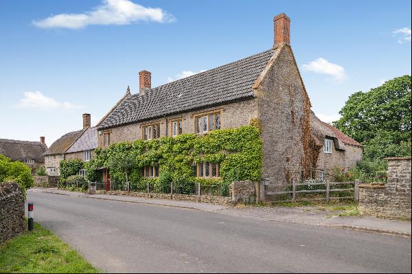 A fascinating mid-17th century village house with potential annexe, outbuildings and part-