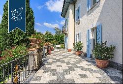 Elegant historical villa with an Italian-style garden for sale near Lake Como