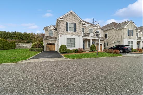 Located in Bishops Pond Condominium Community in Southampton Village, this beautifully des