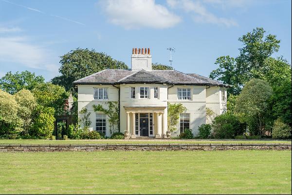 A wonderful Grade II listed Georgian house standing in beautifully landscaped gardens, ben