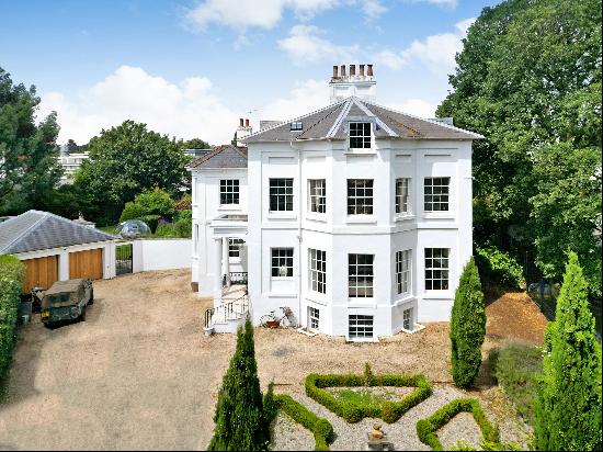 A fine Grade II listed house with five bedrooms, elegant styling, additional accommodation