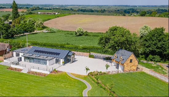 A stunning contemporary barn conversion with a 2 bedroom annex, outbuildings and glorious 