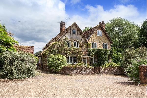A charming Grade II listed farmhouse, with planning permission for external and internal r
