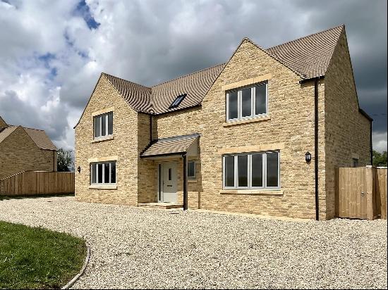 A beautiful Cotswold Stone four bedroom Cotswold stone house with rural views in easy reac