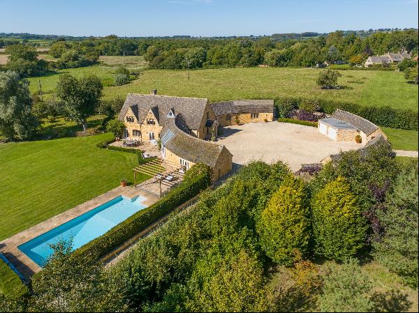 An exceptional Grade II listed Cotswold stone house, beautifully maintained with pretty ru