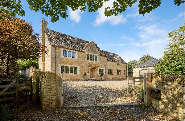 An immaculately presented Cotswold house, in an elevated position overlooking the village 