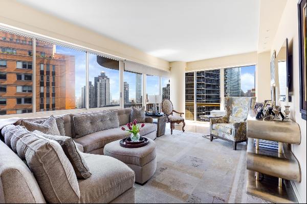 Resting high on the 28th floor of a sought-after luxury cooperative in prime Lenox Hill, s