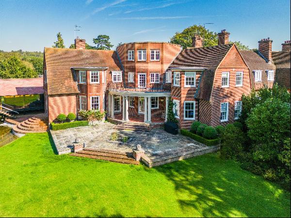 An outstanding period village home with modern extension, set in beautiful grounds.