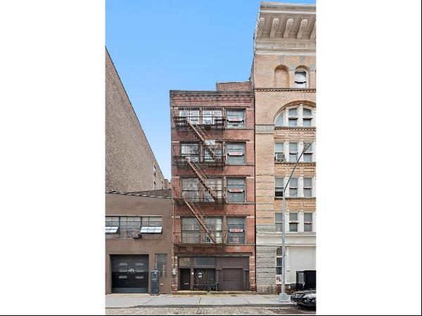Stunning Tribeca mansion with two car garage, rooftop pool, gym, private theater, and as m