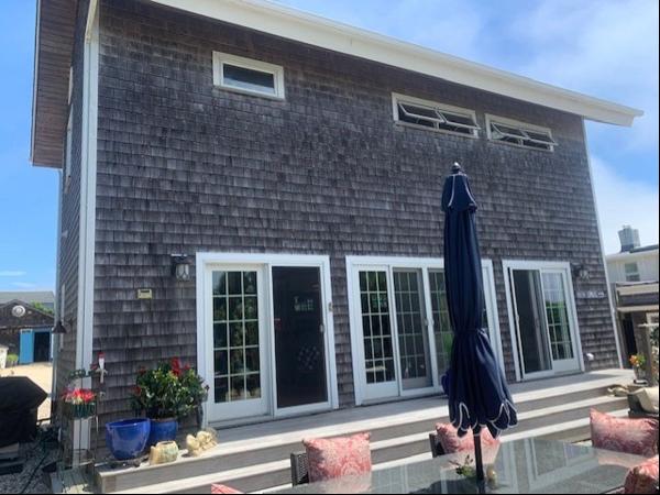 There are four bedrooms and five baths in this oceanfront home. There are three master sui