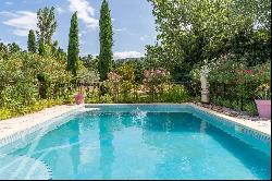 Mas for sale in Les Taillades with a landscaped garden, swimming pool, and beautiful view 