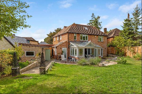 A four bedroom detached house for sale in the Oxshott Way Estate, Cobham.