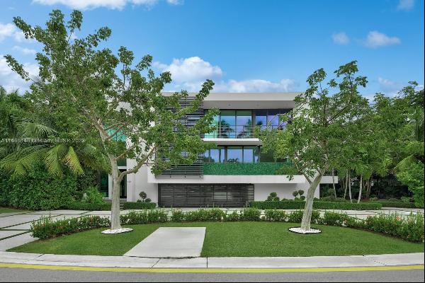 Nestled in the guarded-gated, Hibiscus Island, this modern masterpiece, designed by Ralph 