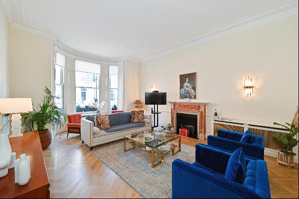 A period five/six bedroom maisonette with outside space for sale in Bina Gardens SW5.
