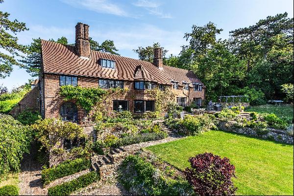 A stunning Grade II listed Arts and Crafts family home within a short walk of the town and