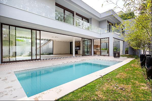 Contemporary-style house surrounded by greenery