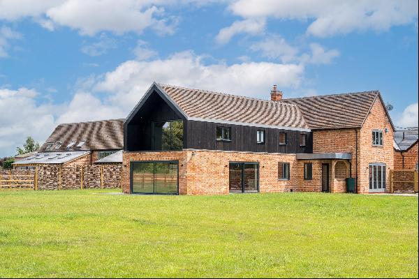 A beautiful barn conversion finished to an exacting standard with wonderful views over the
