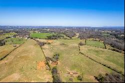 Breathtaking 56-Acre Mountain View Farmstead with Creek Frontage