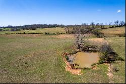 Breathtaking 56-Acre Mountain View Farmstead with Creek Frontage