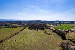 Breathtaking 56-Acre Mountain View Farmstead with Creek Frontage