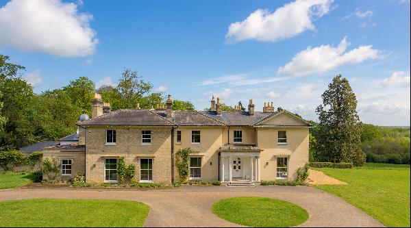 A fine Grade II listed Georgian Country house set in rolling countryside.