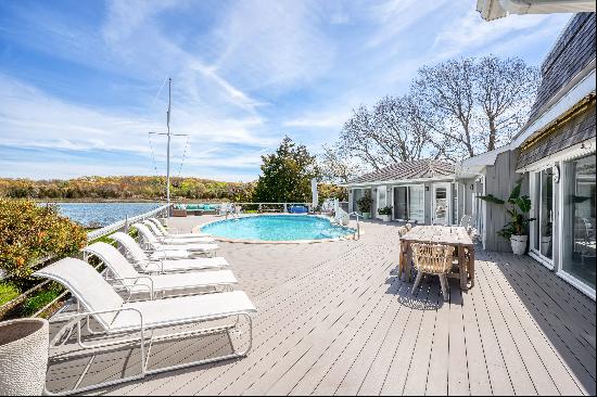 This beautiful home has it all. Stunning water views of Three Mile Harbor with your own pr