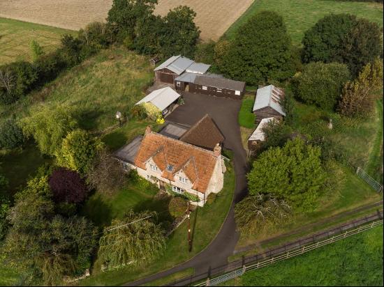 A charming 3 bedroom period cottage requiring full renovation, with outbuildings and land,