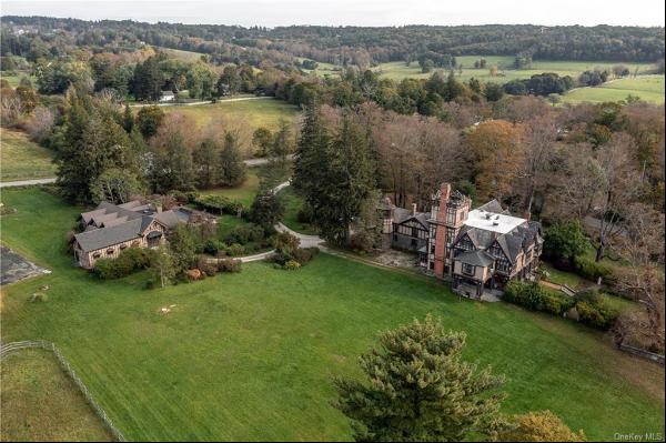 25.5-acre equestrian estate with a 43-room Elizabethan Style manor house, two caretaker ho