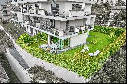 Minusio: elegant, modern apartment with spacious private garden for sale