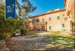 Benedectine abbey founded in the year 730 for sale on Siena's hills