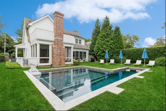 Enjoy your summer in this chic East Hampton village home! Located on a charming tree lined