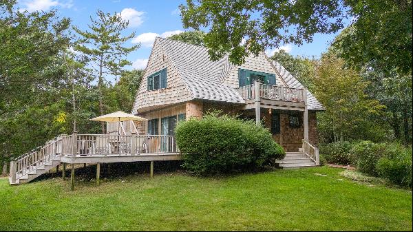 Step into the timeless beauty of this cedar carriage house, initially crafted in 1910 by t