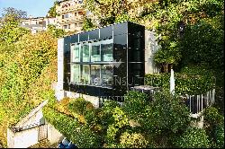 In Montagnola modern design villa with a 180° view of Lake Lugano for sale