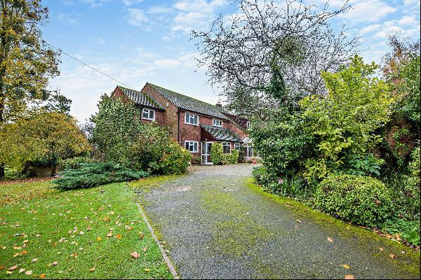 Set over two thirds of an acre and with views of the River Avon, a generous family home re