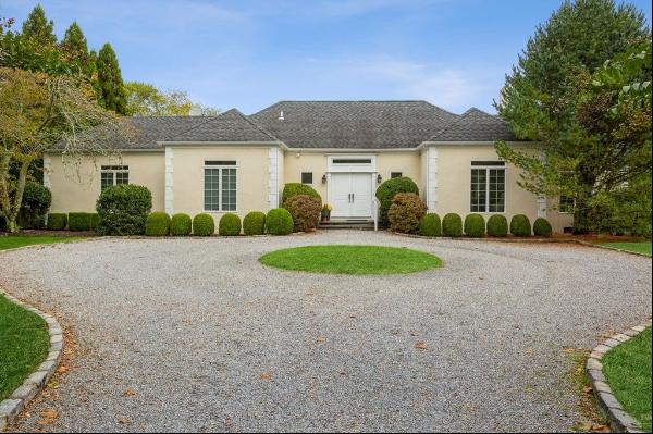 This ultra-private, south of the highway property exemplifies Hampton's elegance. Located 