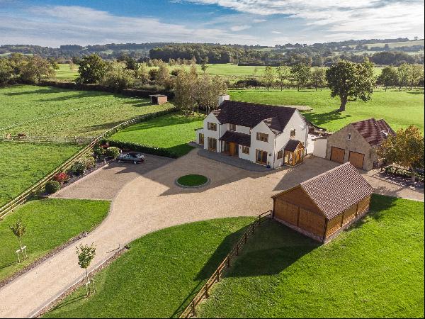 A superb contemporary country house situated in a stunning setting surrounded by its land 
