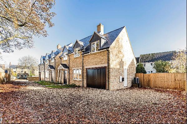 An exceptionally well-designed new detached Cotswold stone house with a high-spec finish a