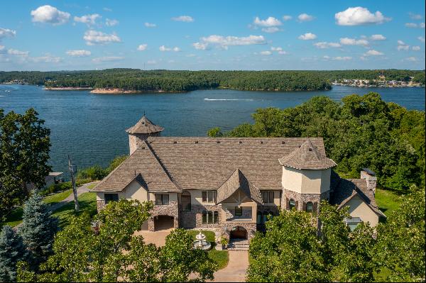 Welcome to Stone Mansion, a truly iconic lakefront masterpiece