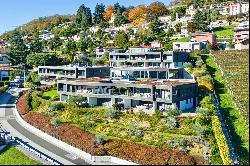 Prestigious duplex apartment in Porza with private garden & wide view of Lake Lugano for 