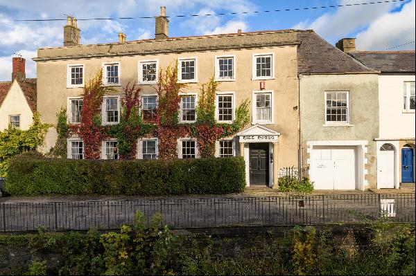 An attractive south facing Grade II listed town house with walled garden, garage and easy 