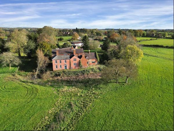 A vast detached 18th century farmhouse located in a glorious setting in Gayton, set within